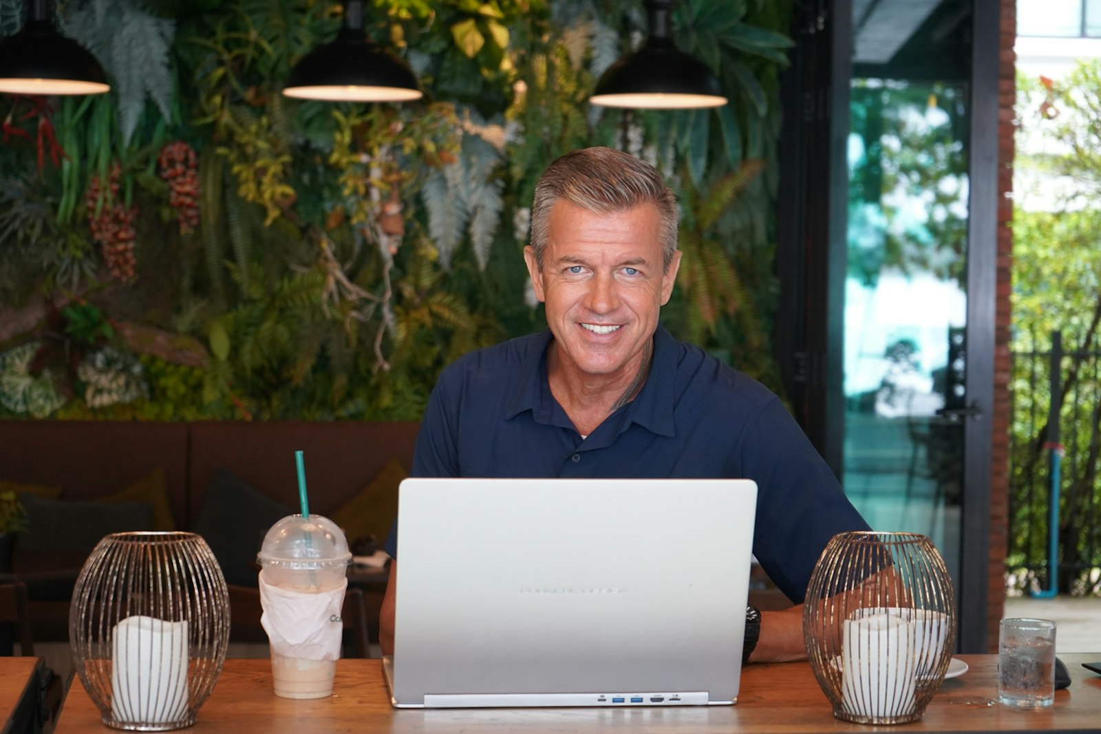 Business owner working on a laptop at a table