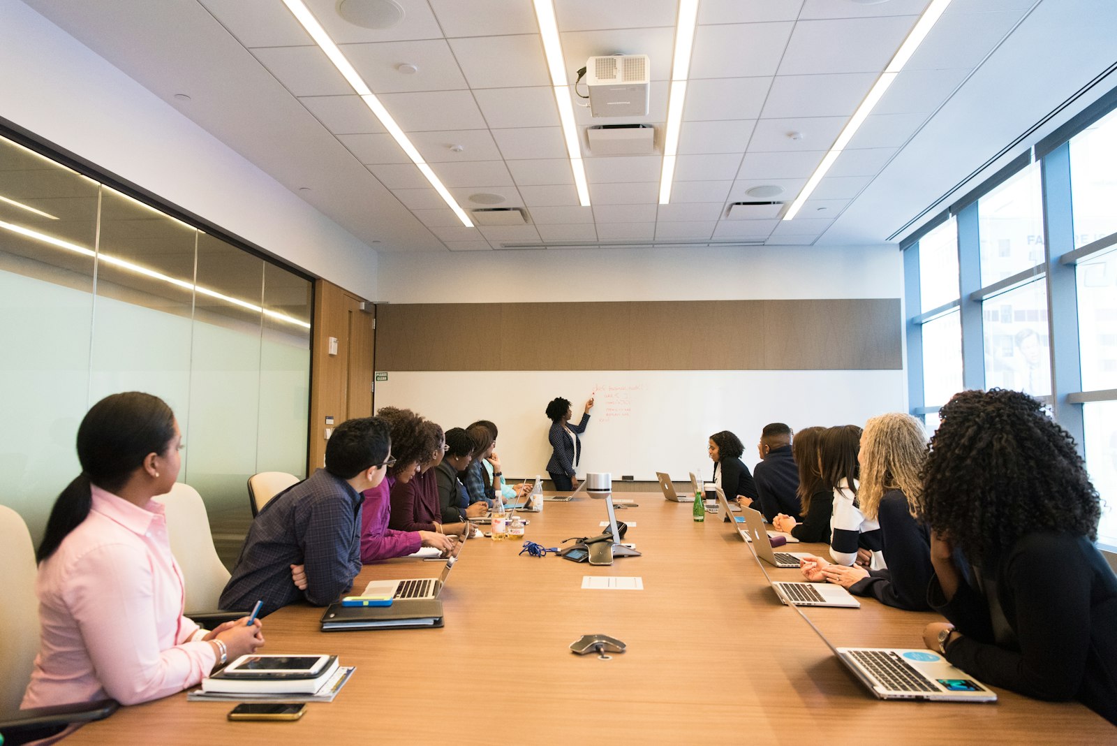 Leadership team listening to a presenter in a conference room
