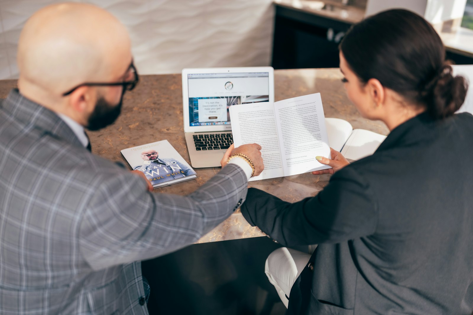 Consultant reviewing a printed report